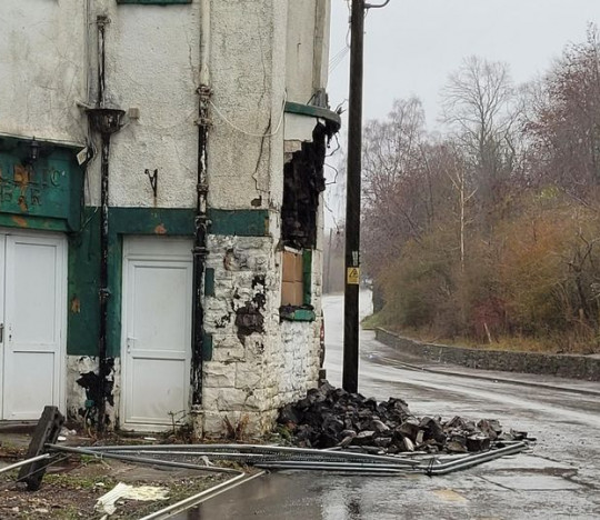 Part of disused pub collapses onto street